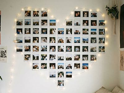 Wall decor with mini photos arranged in a heart shape