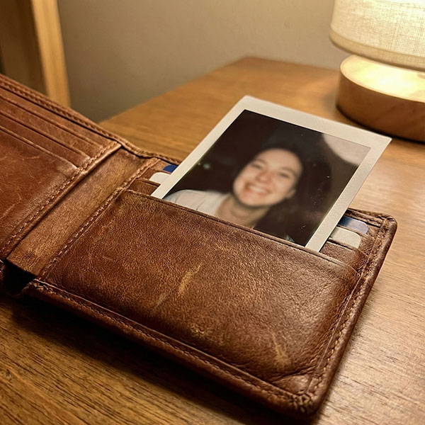 Instax mini photo inside a leather wallet card slot