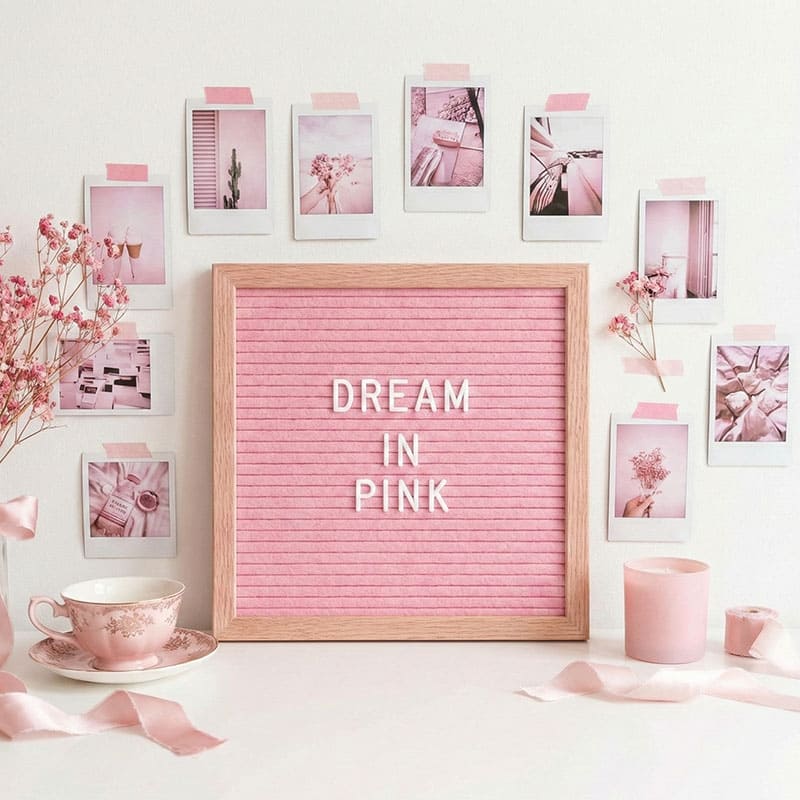 Creative workspace with pink aesthetic mood board