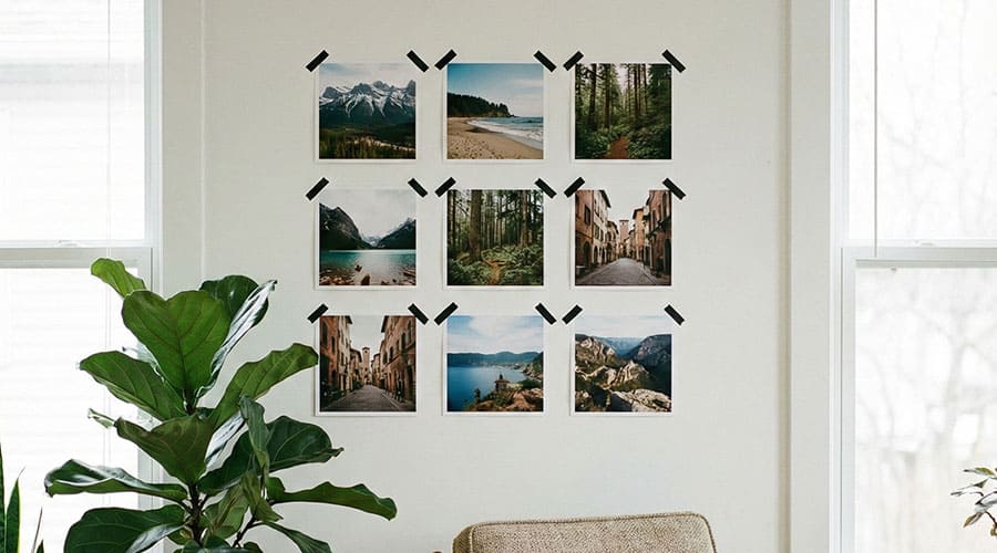 3x3 grid of square photos on living room wall with washi tape